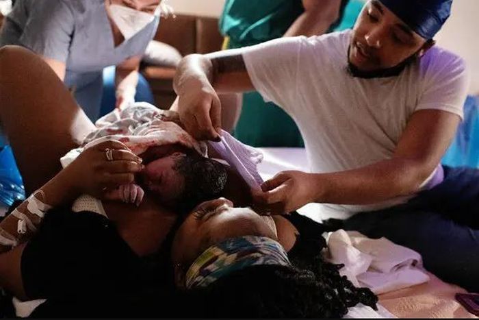 Being in the delivery room with your wife is more than just witnessing the birth of your child [NYT]