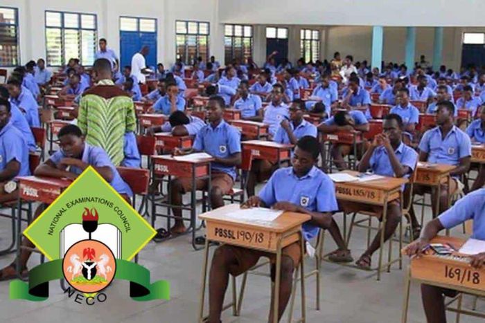 Students writing the National Examinations Council exam.