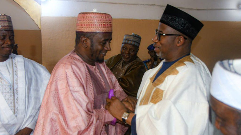 Senator Shehu Umar Buba (left) and Governor Bala Mohammed (right) exchanging pleasantries at an event. [Facebook]