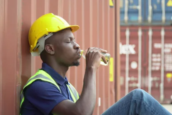 A man drinking water [Shutterstock]