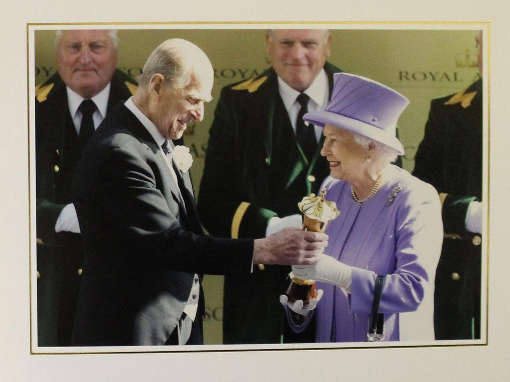 2012: The Duke of Edinburgh is seen presenting his wife with a trophy after her horse won the Queen's Vase at Royal Ascot in June 2012.
