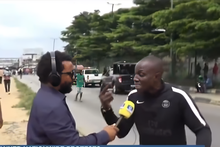 Mr Ogwu Benjamin Chijioke and a TV reporter. [Screengrab]