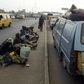 Beggars sit on Lagos Ikorodu highway 06 February 2006. Lagos is reputed as one of the mostly densely populated city in the world with population more than 14 million. [Getty Images]