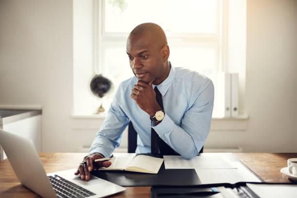 A man using a laptop in an office