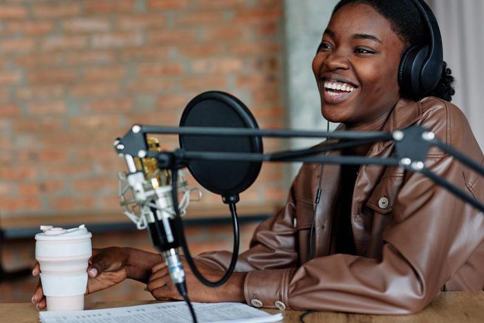 A woman anchoring a podcast [Spotify Advertising]