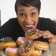 Woman eating doughnut(shutterstock)