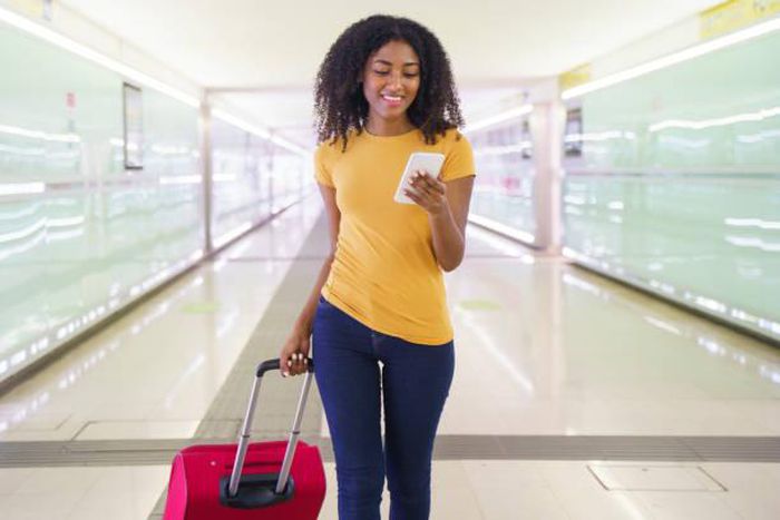 Black woman at the airport [iStock]