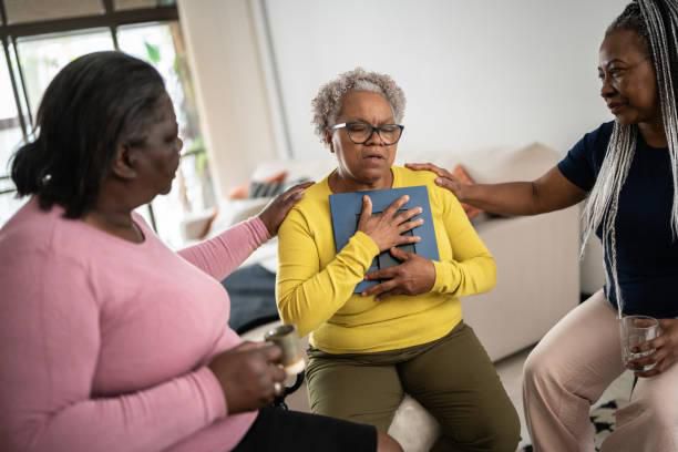 A woman in mourning being comforted