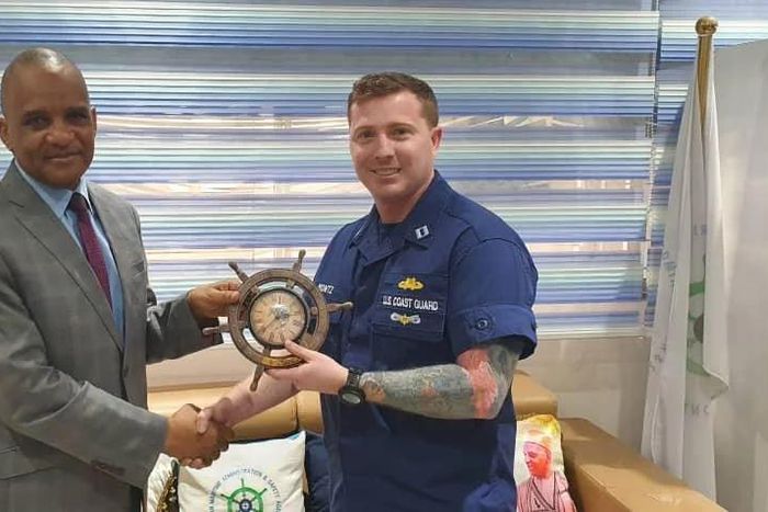 L -R: Director General, Nigerian Maritime Administration and Safety Agency, NIMASA, Dr Bashir Jamoh, OFR presenting souvenir to United States Coast Guard (USCG) Advisor, Lt. Benjamin Montz during a courtesy visit by the USCG to the NIMASA headquarters ...