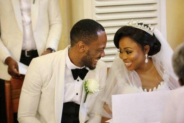 Toyosi Phillips and Etim Effiong share an excited smile at their wedding ceremony, November 4, 2017.