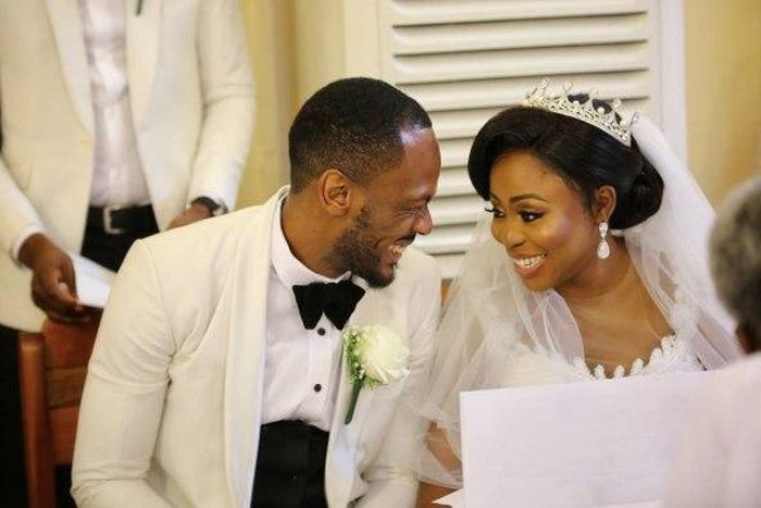 Toyosi Phillips and Etim Effiong share an excited smile at their wedding ceremony, November 4, 2017.