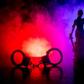A pair of handcuffs and Lady Justice (image used for illustrative purpose) [Adobe Stock]