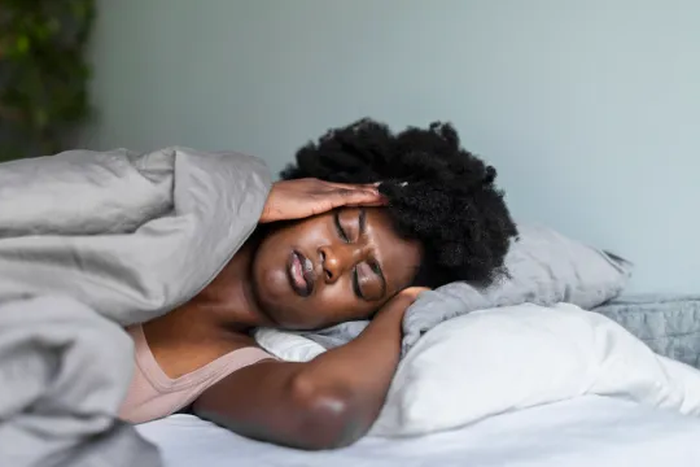 Sleeping position that causes nightmares [bestlife]