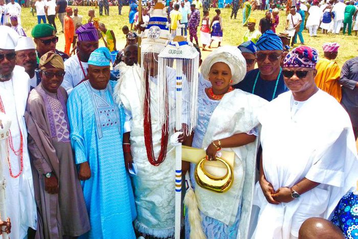 Middle: The monarch, Oba Olusola Idris Adebowale Lamidi-Osolo and his wife, Olori Taibat Osolo during the staff of office presentation ceremony. [Pulse]