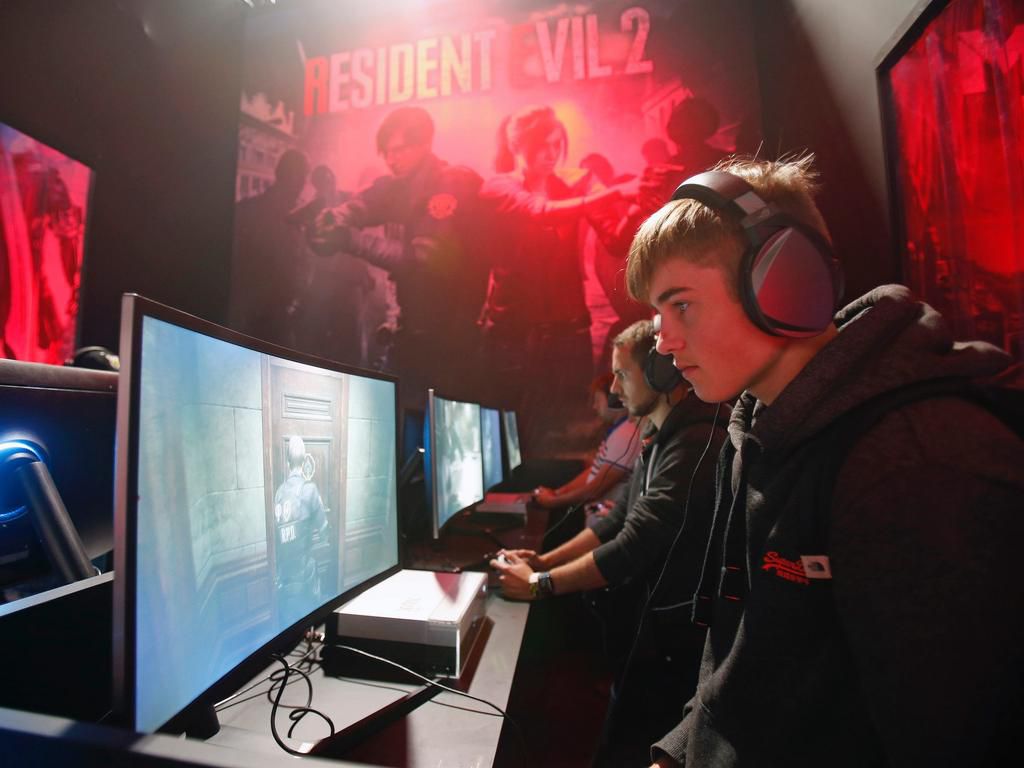 Gamers play Capcom's 'Resident Evil 2 Remake' during Paris Games Week on October 27, 2018 in Paris, France.