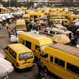 Yellow Danfo taxi drivers wait for customers at the Obalende bridge in Lagos on February 20, 2023, five days ahead of the Nigerian presidential election. [Getty Images]