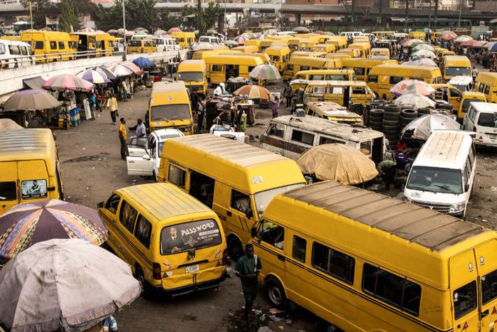 Yellow Danfo taxi drivers wait for customers at the Obalende bridge in Lagos on February 20, 2023, five days ahead of the Nigerian presidential election. [Getty Images]