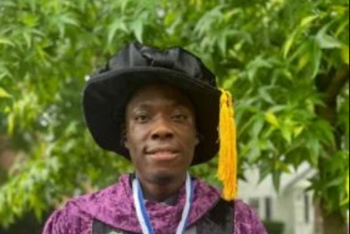 Emmanuel Ahmadu, a Nigerian graduate in a photograph displaying his two honorary doctorate degrees in United States of America [NAN]