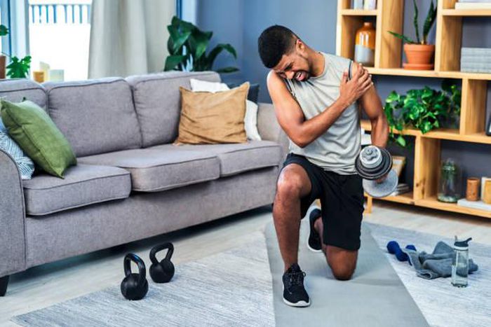 Man experiencing post work out pain