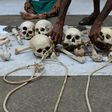 An Indian farmer from Tamil Nadu state arranges human skulls, said to belong to farmers who had committed suicide, during a protest in New Delhi on August 1, 2017