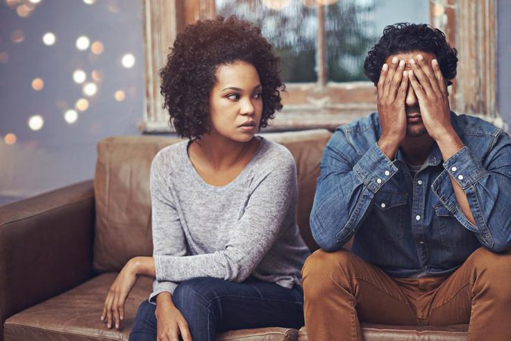 Unhappy man cowering in the face of his partner's angry look [Credit: Martha Stewart Weddings]