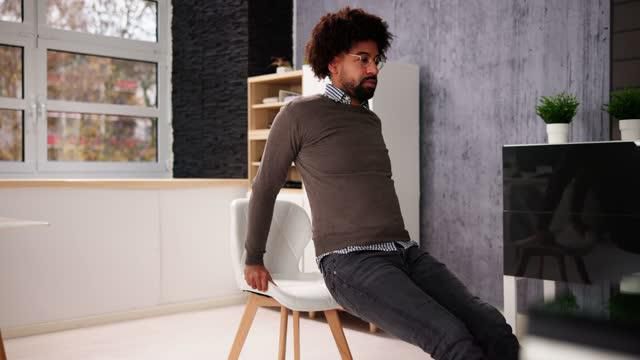 Use a stable chair for triceps dips [iStockphoto]