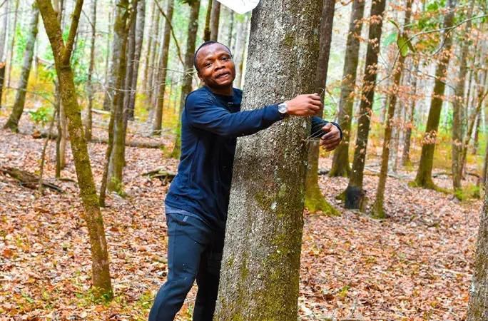 Ghanaian environmentalist sets new Guinness World Record by hugging 1,123 trees in one hour