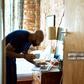 A man using a computer on dressing table