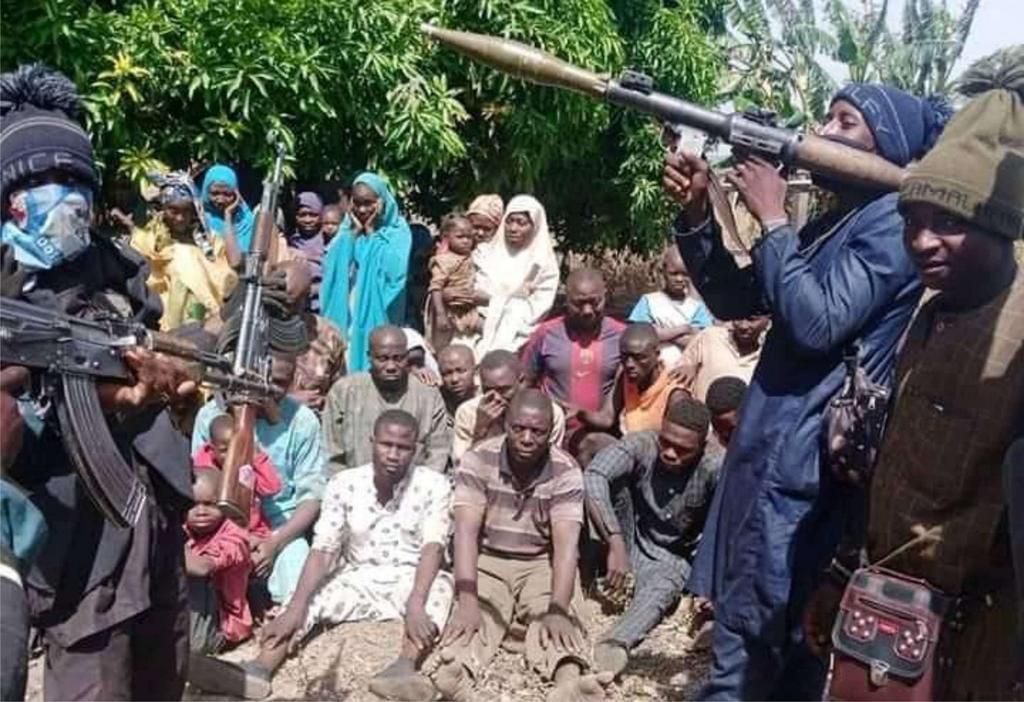 Kidnapped students and teachers amidst heavily armed bandits.