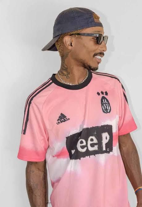 Pharrell Williams wearing the human race Juventus jersey [soccerbible]