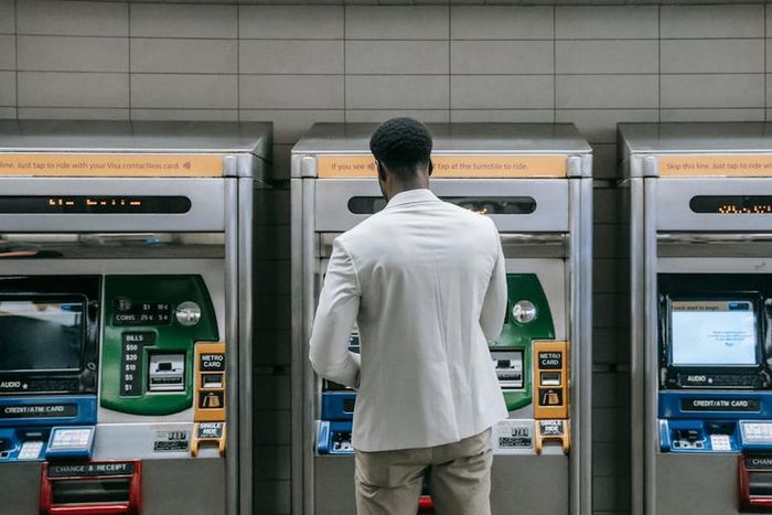 Man standing in front of a machine [Image Credit: Liliana Drew]