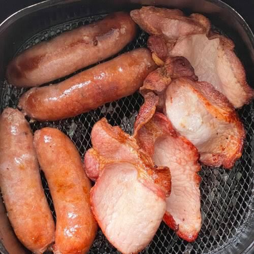 Cook the bacon and sausages [RecipeThis]