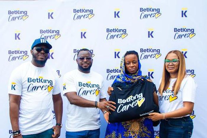 From left to right: Grand Master Agent, Bello Adeniyi; Managing Director, BetKing Nigeria, Gossy Ukanwoke; Beneficiary of the BetKing Cares Food Drive Initiative, Mrs. Olabunmi Adekunle, and Head of HR Operations, BetKing Nigeria, Bonike Ayanbadejo at ...