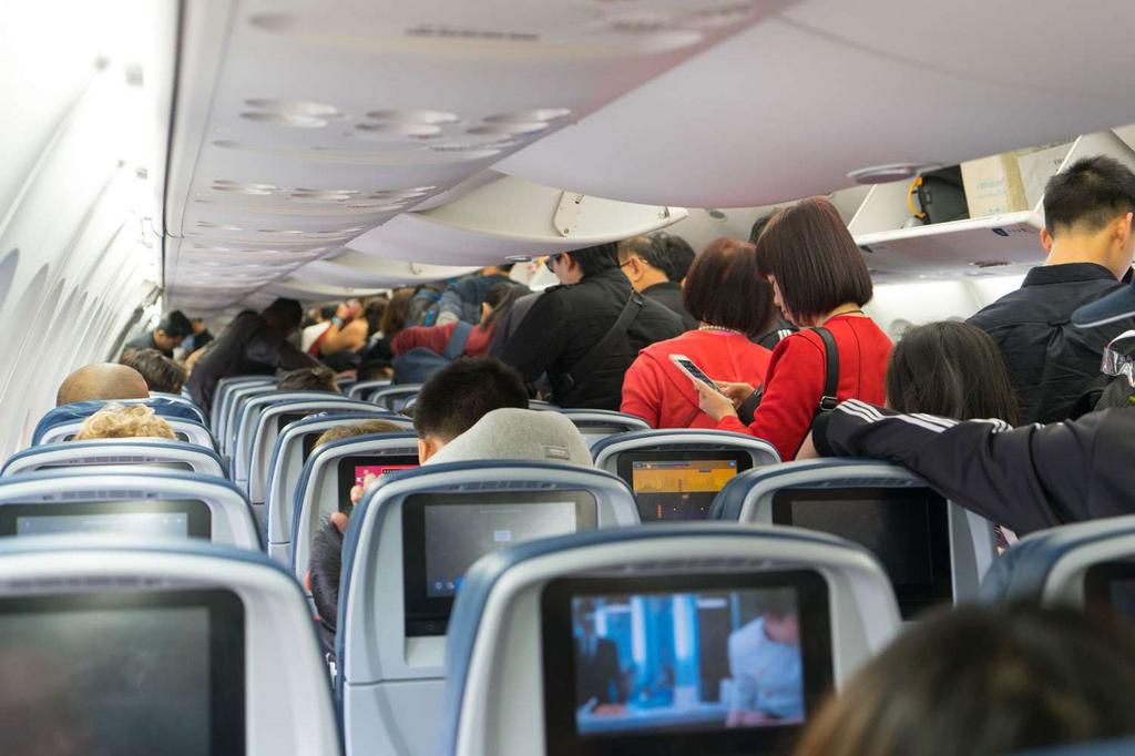 Don't stand up as soon as the plane lands [People]