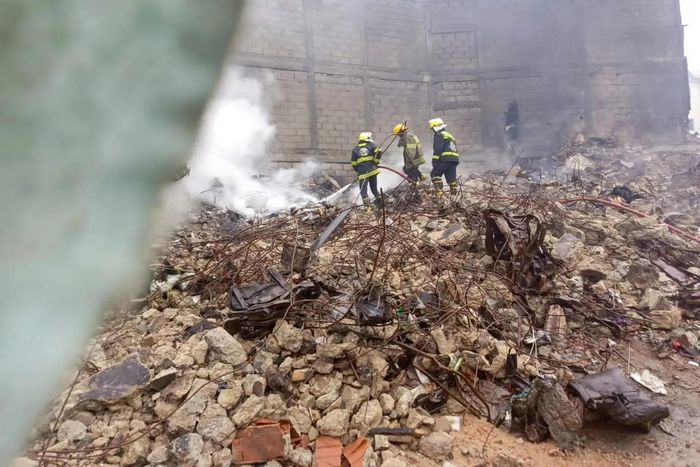 P.S LASEMA, Dr Olufemi Oke- Osanyintolu, supervising the carting away of rubbles from the scene of Dosunmu fire incident [NAN]