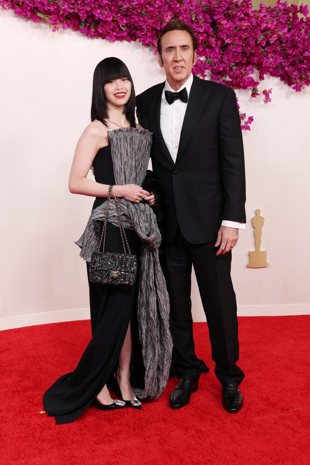 Nicolas Cage and his wife, Riko Shibata, matched in black outfits.