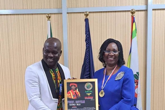 Mr Dominic Mensah,President, of the organisation presenting the award to LASU VC [NAN]