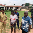Re-arrested prison escapee, Chinonso Kalu (c) being handed over to the NCoS by the NSCDC in Owerri on Friday [NAN]
