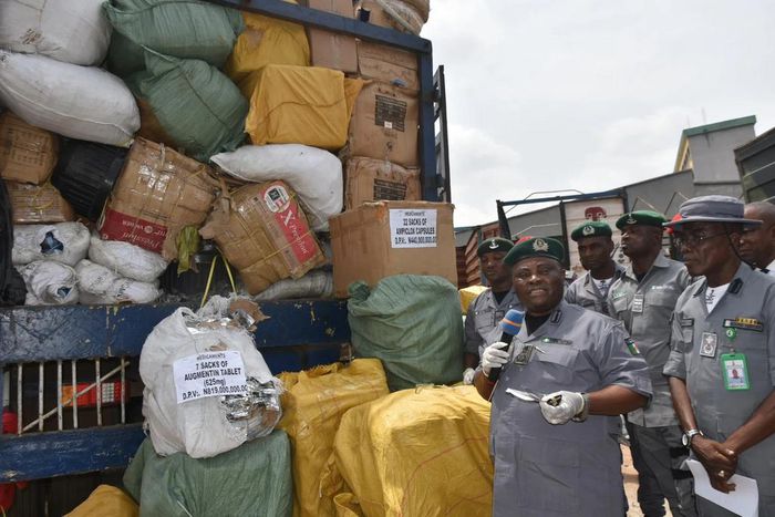 Oyo/Osun Customs Area Controller, Dr Ben Oramalugo showcasing seized fake pharmaceutical drugs to newsmen on Thursday in Ibadan [NAN]