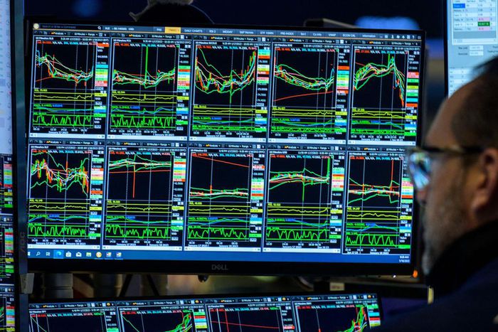 A trader looks at market charts on the floor of the New York Stock Exchange on January 18, 2023.Angela Weiss/AFP/Getty Images