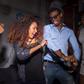 Young man and woman dancing at house party - stock photo