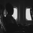 Black woman on a plane [Unsplash]