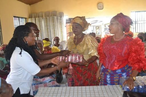 L-R: Assistant Program Officer, New Nigeria Foundation (NNF), Chinwendu Obinna Osuji, presenting packs of International Breweries Beta Malt drinks to the President, Rumuoghu Community Women Group, Mrs Gladys Ovunwo, and the Secretary Mrs Edna Wogu, at ...