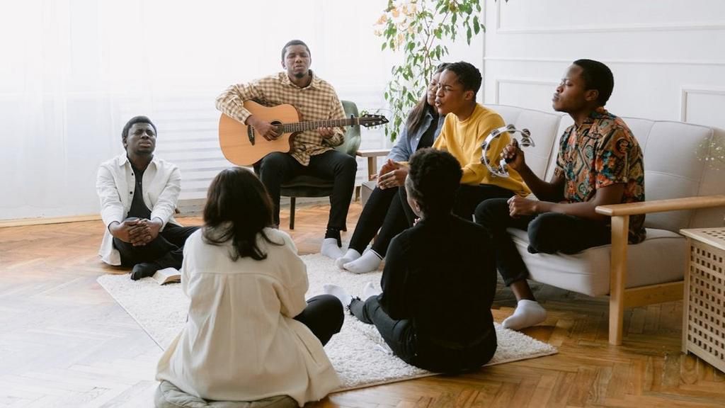 A group of people praying together [Image Credit: Tima Miroshnichenko]