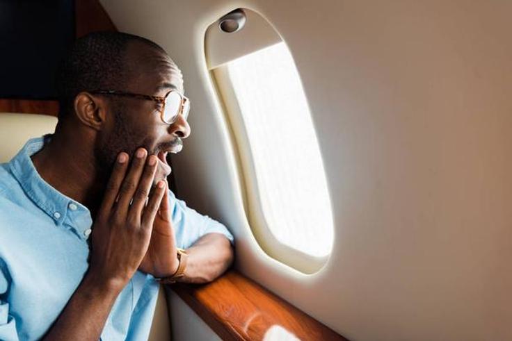 Black man on a plane [VistaFree]