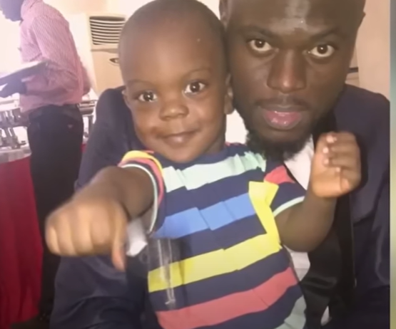 Ayoola Ayolola and his baby boy [With Chude]