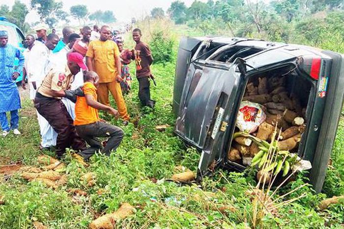 A FRSC officer offers help to an accident victim.