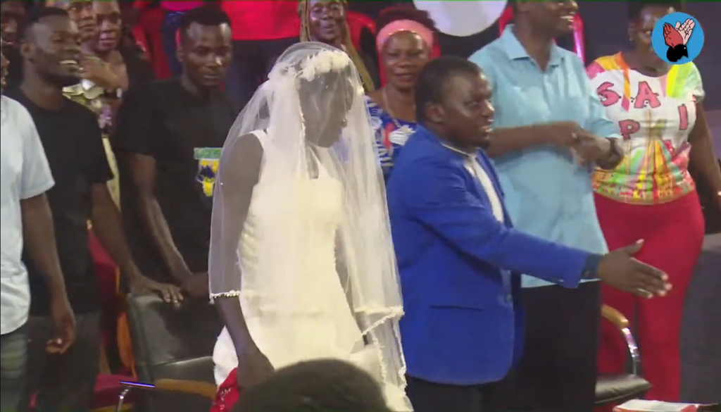 The woman was called to the pulpit to be prayed for