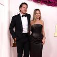 Margot Robbie strayed from "Barbie" fashion, and her husband, Tom Ackerley, followed suit.