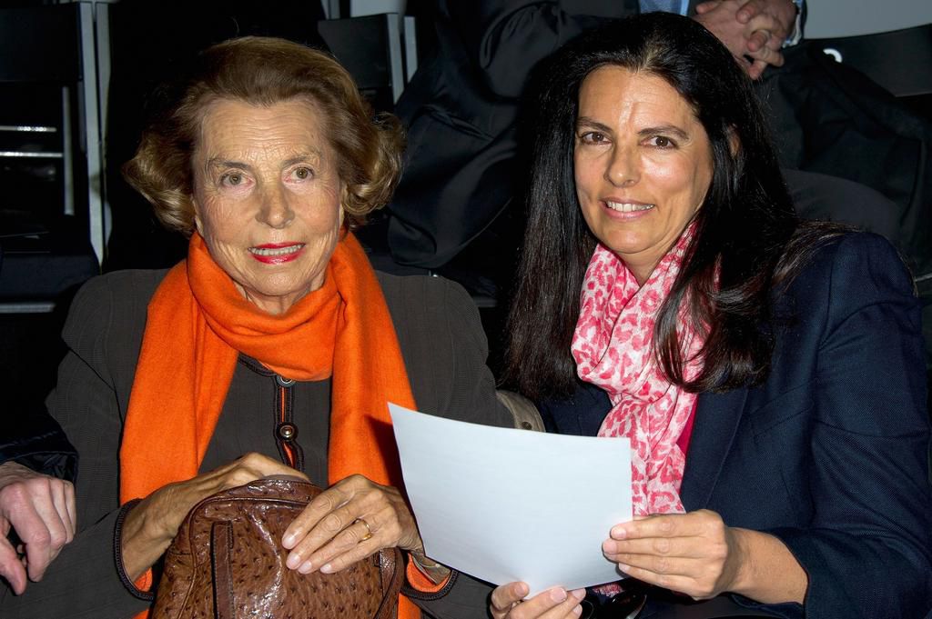 Liliane Bettencourt and daughter Françoise Bettencourt-Meyers at Paris Fashion Week in 2012.
